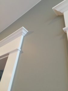 Closeup view of painting cut in lines, where walls meet the trim and ceilings